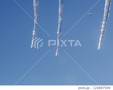 Three icicles hanging from the sky Three icicles hanging from the sky 128867509