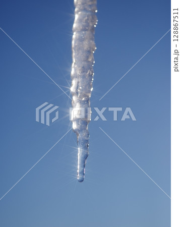 A long icicle hanging from the sky A long icicle hanging from the sky 128867511