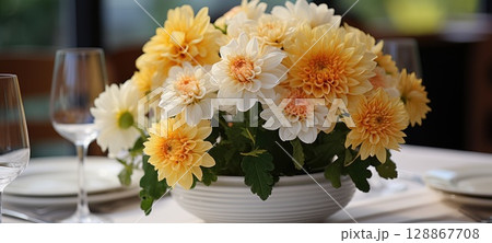 event table setting with chrysanthemum flower arrangement, ai 128867708