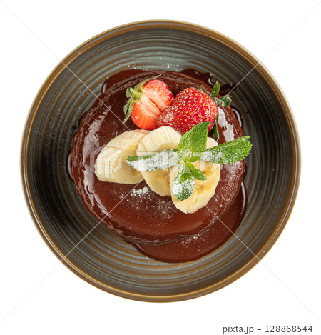 Chocolate pancakes with banana slices and mint Chocolate pancakes with banana slices and mint 128868544