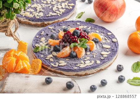 Cheesecake with tangerines and blueberries 128868557