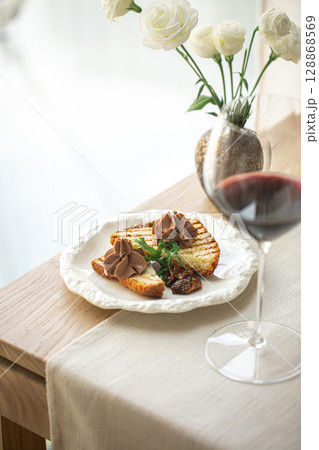 Chicken liver pate on grilled toast with fig jam Chicken liver pate on grilled toast with fig jam 128868569