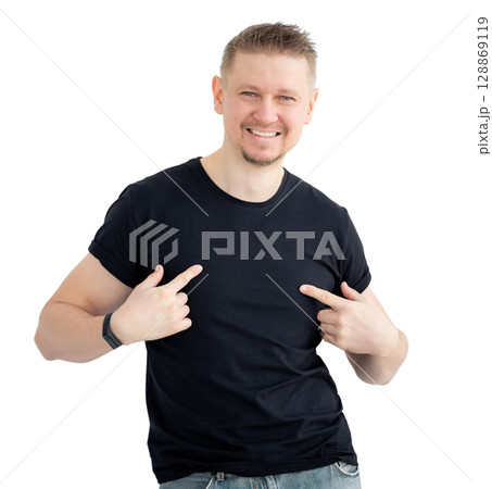 Attractive Man Pointing At Blank Black T-Shirt Isolated On A White Background Attractive Man Pointing At Blank Black T-Shirt Isolated On A White Background 128869119