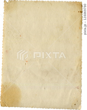 Antique paper sheet with ripped edges and vintage texture. Aged and ragged parchment look. 128869780