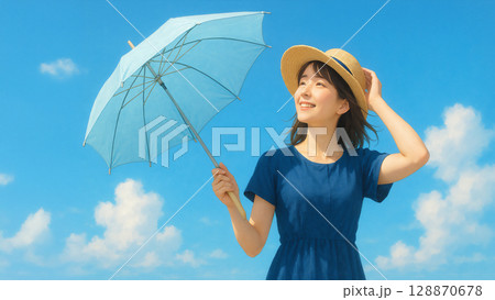 日傘をさして麦わら帽子を被る女性 128870678