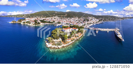 Greece travel destination scenic places - Skiathos island, Sporades., aerial drone panoramic view of old town Greece travel destination scenic places - Skiathos island, Sporades., aerial drone panoramic view of old town 128871050