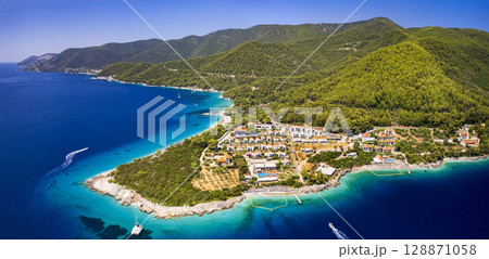 Greece summer destinations. Aerial view of Milia and Panormos - most beautiful beaches in Skopelos island, Sporades. 128871058