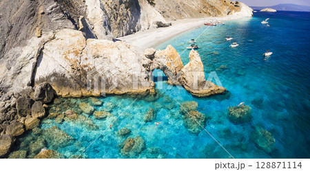 Best iconic beaches of Greece, Sporades - beautiful Lalaria beach with turquoise sea and arc rocks formation. Greek summer destinations.  128871114