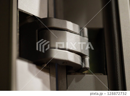 metal hidden black door hinge, close-up, furniture 128872732