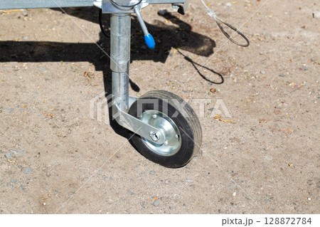 Trailer wheel for attachment to a vehicle towbar, close-up. Copy space for text Trailer wheel for attachment to a vehicle towbar, close-up. Copy space for text 128872784