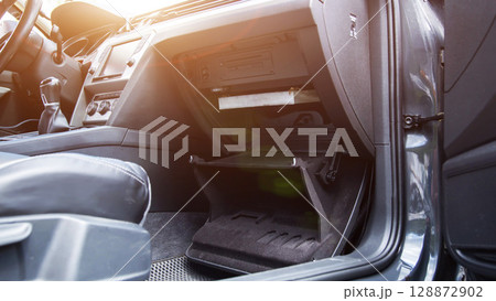 Replacing an old dirty cabin filter with a new one. Car maintenance, close-up 128872902