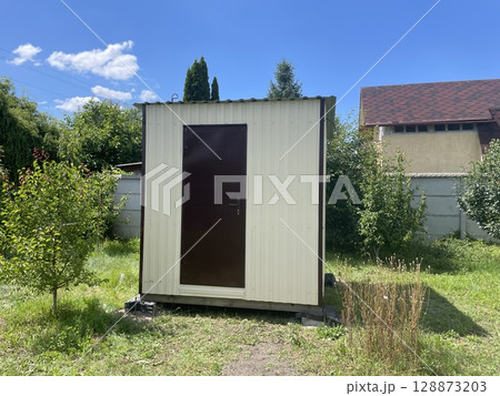 Cozy small garden house wagon for summer living Cozy small garden house wagon for summer living 128873203