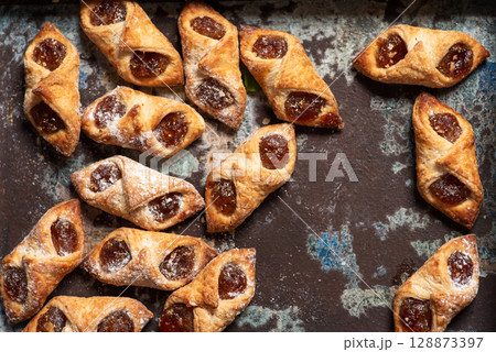 Homemade Baked Pastries With Fruit Filling And Icing Sugar 128873397