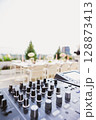 Outdoor DJ setup at dusk, bathed in dynamic lights 128873413