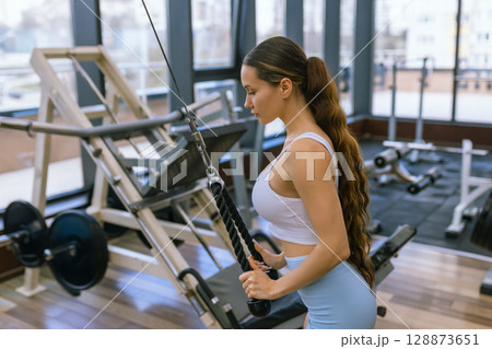Sexy fitness woman doing exercises. Healthy lifestyle concept. Cross-fit bodybuilder in gym. Sexy fitness woman doing exercises. Healthy lifestyle concept. Cross-fit bodybuilder in gym. 128873651
