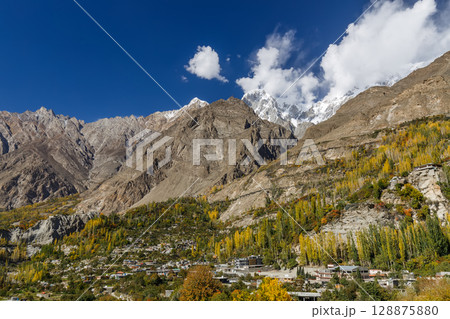 The landscape of Hunza Valley In Autumn Season, with mountain range in the background,Hunza, Pakistan. The landscape of Hunza Valley In Autumn Season, with mountain range in the background,Hunza, Pakistan. 128875880