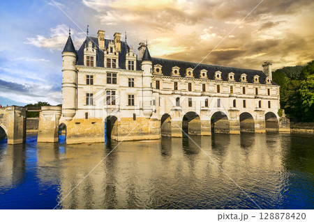 France, Loire valley castles. Elegant Chenonceau chateau over sunset. Most beautiful and romantic french castles France, Loire valley castles. Elegant Chenonceau chateau over sunset. Most beautiful and romantic french castles 128878420