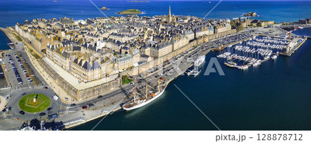 aerial panoramic view of Saint -Malo , historic French port in Ille-et-Vilaine, Brittany. France travel and landmarks. drone view of old city and harbour 128878712