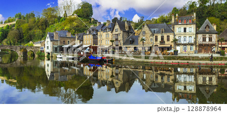 France travel, most scenic villages and towns of Brittany. Picturesque traditional port of Dinan with half-timbered houses, restaurants over canals France travel, most scenic villages and towns of Brittany. Picturesque traditional port of Dinan with half-timbered houses, restaurants over canals 128878964