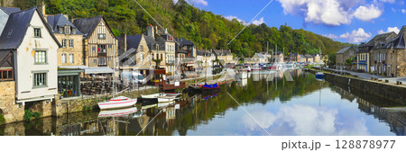 France travel, most scenic villages and towns of Brittany. Picturesque traditional port of Dinan with half-timbered houses, restaurants over canals France travel, most scenic villages and towns of Brittany. Picturesque traditional port of Dinan with half-timbered houses, restaurants over canals 128878977
