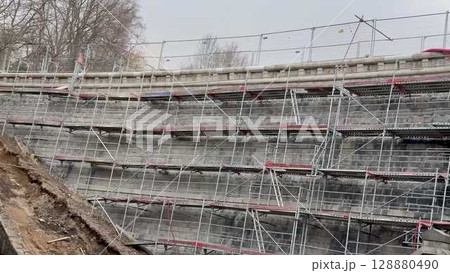Construction Scaffolding on a Building That is Currently Undergoing Renovation Work 128880490
