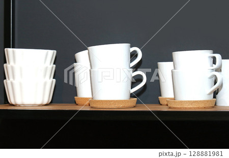 Ceramic white cups and bowls Ceramic white cups and bowls 128881981
