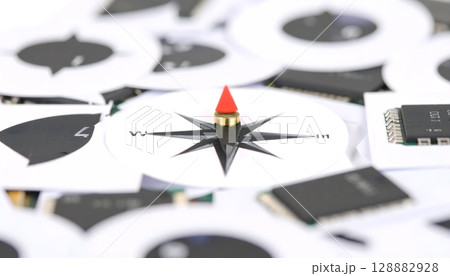 Macro Close-up of Compass on Circuit Board Components 128882928