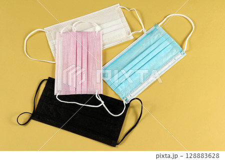 Pile of colorful face masks 128883628