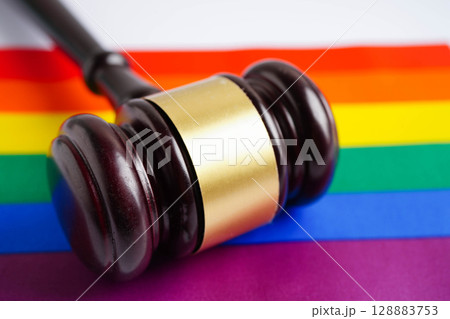 Gavel for judge lawyer on rainbow flag, symbol of LGBT pride month. Gavel for judge lawyer on rainbow flag, symbol of LGBT pride month. 128883753