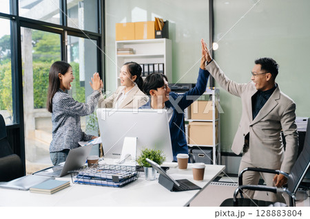 Young people professional colleagues are stretching arms showing team spirit focus on hands Young people professional colleagues are stretching arms showing team spirit focus on hands 128883804