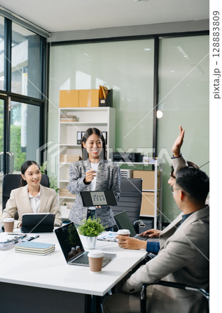 Young business creative team are brainstorming planning discussing while sitting in creative business discussing work 128883809