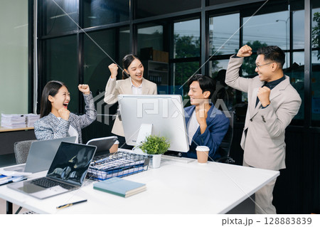 Office colleagues have a casual discussion. During a meeting in a conference room, a group of business teem Office colleagues have a casual discussion. During a meeting in a conference room, a group of business teem 128883839