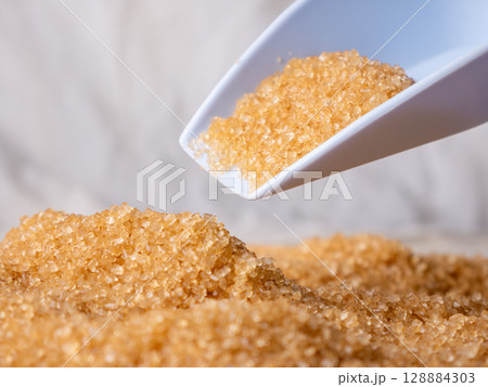 Organic Light Brown Sugar with versatile scoop. Organic Light Brown Sugar with versatile scoop. 128884303