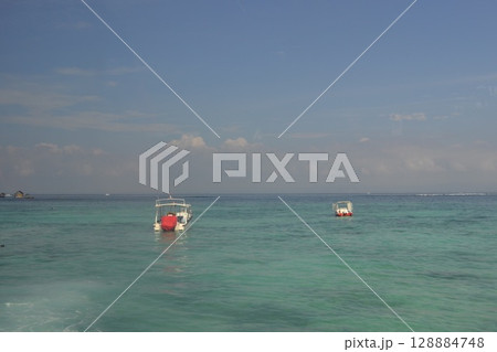 Two boats on the sea 128884748