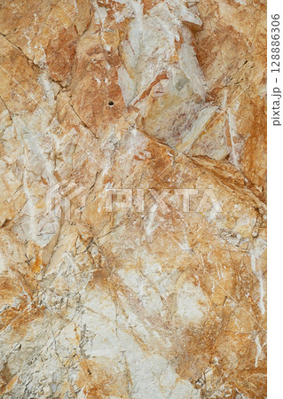 Geological rock formation with rough texture for abstract background or nature concept. 128886306