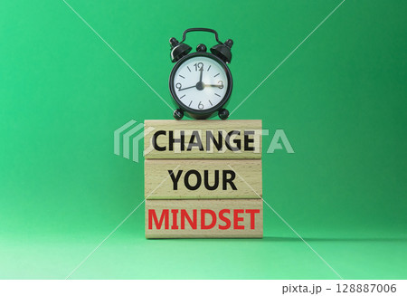 Change your mindset symbol. Concept words Change your mindset on wooden blocks with alarm clock. Beautiful green background. Business and Change your mindset concept. Copy space. Change your mindset symbol. Concept words Change your mindset on wooden blocks with alarm clock. Beautiful green background. Business and Change your mindset concept. Copy space. 128887006