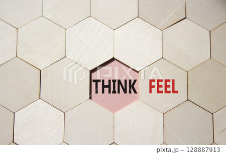 Think or Feel symbol. Concept word Think or Feel on wooden comb puzzle. Beautiful pink background. Business and Think or Feel concept. Copy space Think or Feel symbol. Concept word Think or Feel on wooden comb puzzle. Beautiful pink background. Business and Think or Feel concept. Copy space 128887913