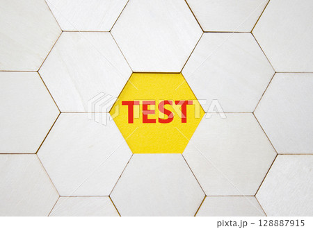 Test symbol. Concept word Test on wooden comb puzzle. Beautiful yellow background. Business and Test concept. Copy space. 128887915