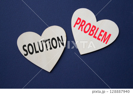 Solution vs Problem symbol. Concept word Solution vs Problem on wooden hearts. Beautiful deep blue background. Business and Solution vs Problem concept. Copy space Solution vs Problem symbol. Concept word Solution vs Problem on wooden hearts. Beautiful deep blue background. Business and Solution vs Problem concept. Copy space 128887940