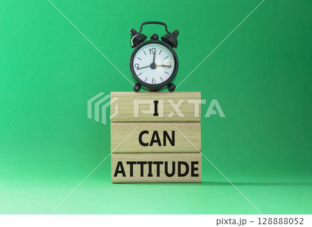I Can Attitude symbol. Wooden blocks with words I Can Attitude. Beautiful green background with alarm clock. Business and I Can Attitude concept. Copy space. 128888052