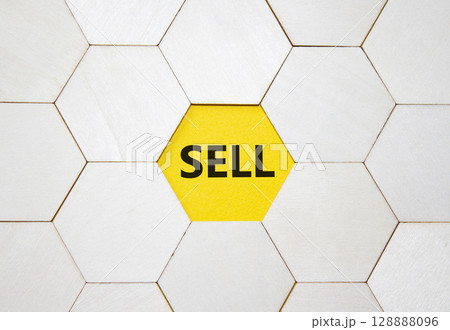Sell symbol. Concept word Sell on wooden comb puzzle. Beautiful yellow background. Business and Sell concept. Copy space. Sell symbol. Concept word Sell on wooden comb puzzle. Beautiful yellow background. Business and Sell concept. Copy space. 128888096