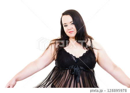 Woman in black lingerie showing her breast chest. 128895978