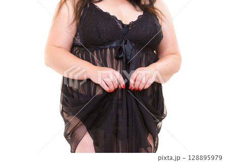 Woman in black lingerie showing her breast chest. 128895979