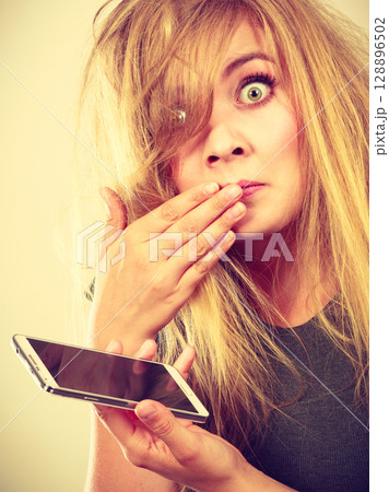 Crazy young woman talking on phone 128896502