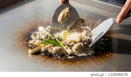 鉄板で焼く牡蠣のバター焼き 128896676
