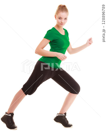 Sport. Flexible fitness girl doing stretching exercise 128896789