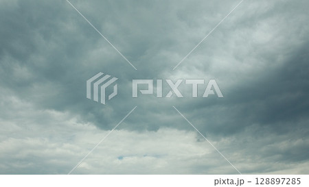 A Dramatic Cloudy Sky Displaying Various Shades of Grey and Unsettled Atmosphere A Dramatic Cloudy Sky Displaying Various Shades of Grey and Unsettled Atmosphere 128897285