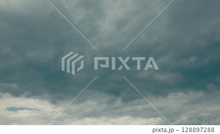Dramatic Cloudy Skies Presenting a Rich Palette of Various Shades of Grey and Other Tones Dramatic Cloudy Skies Presenting a Rich Palette of Various Shades of Grey and Other Tones 128897288