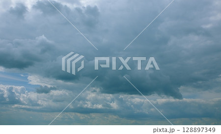 A Dramatic Cloudy Sky Filled with Beautiful Gray Clouds Painting an Atmospheric Scene A Dramatic Cloudy Sky Filled with Beautiful Gray Clouds Painting an Atmospheric Scene 128897349