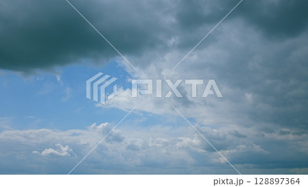 Dramatic Cloud Scenery A Beautiful and Captivating Sky Transition with Dynamic Colors and Shapes Dramatic Cloud Scenery A Beautiful and Captivating Sky Transition with Dynamic Colors and Shapes 128897364